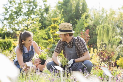 Professional gardeners following health and safety procedures outdoors